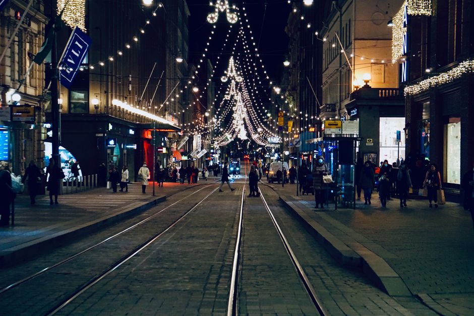 Night view of Helsinki's downtown with Christmas lights and trams